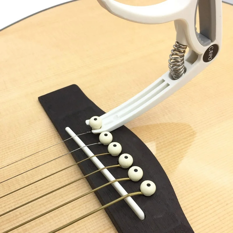 Plastikowy Capo gitarowy na 6  – Musical Instrument Dulcimer recenzja i cena